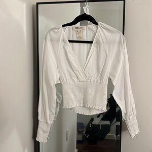 White Diane Von Furstenberg blouse with synched waist.
